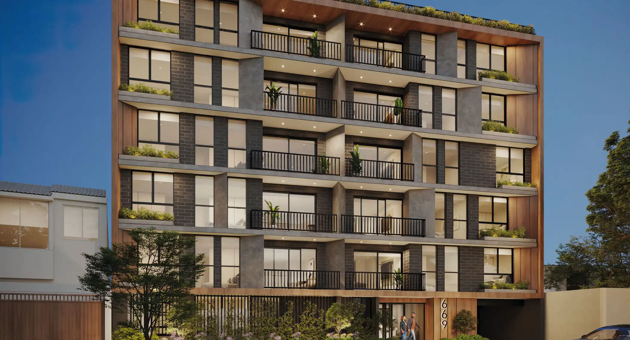 Vista arquitectónica nocturna del Proyecto Inmobiliario moderno en Surco