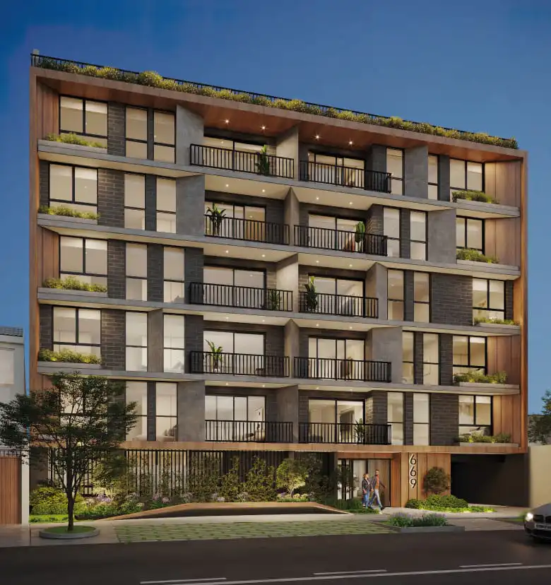 Vista de la fachada arquitectónica nocturna del Proyecto Inmobiliario Instant en Surco.